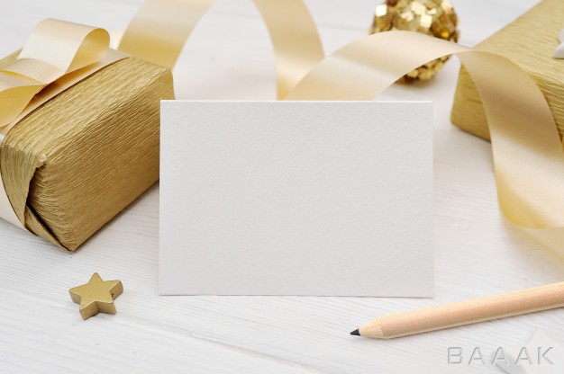 موکاپ-زیبا-و-جذاب-Mockup-christmas-greeting-card-with-gold-gift-ribbon_985113269